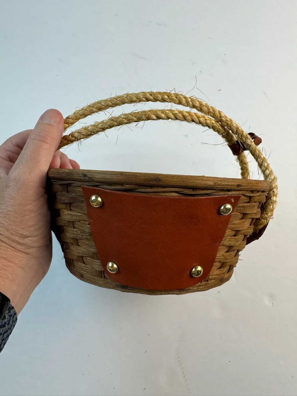 Vintage mid-centuryWoven Straw basket with Brown Leather Panels and Rope Handle